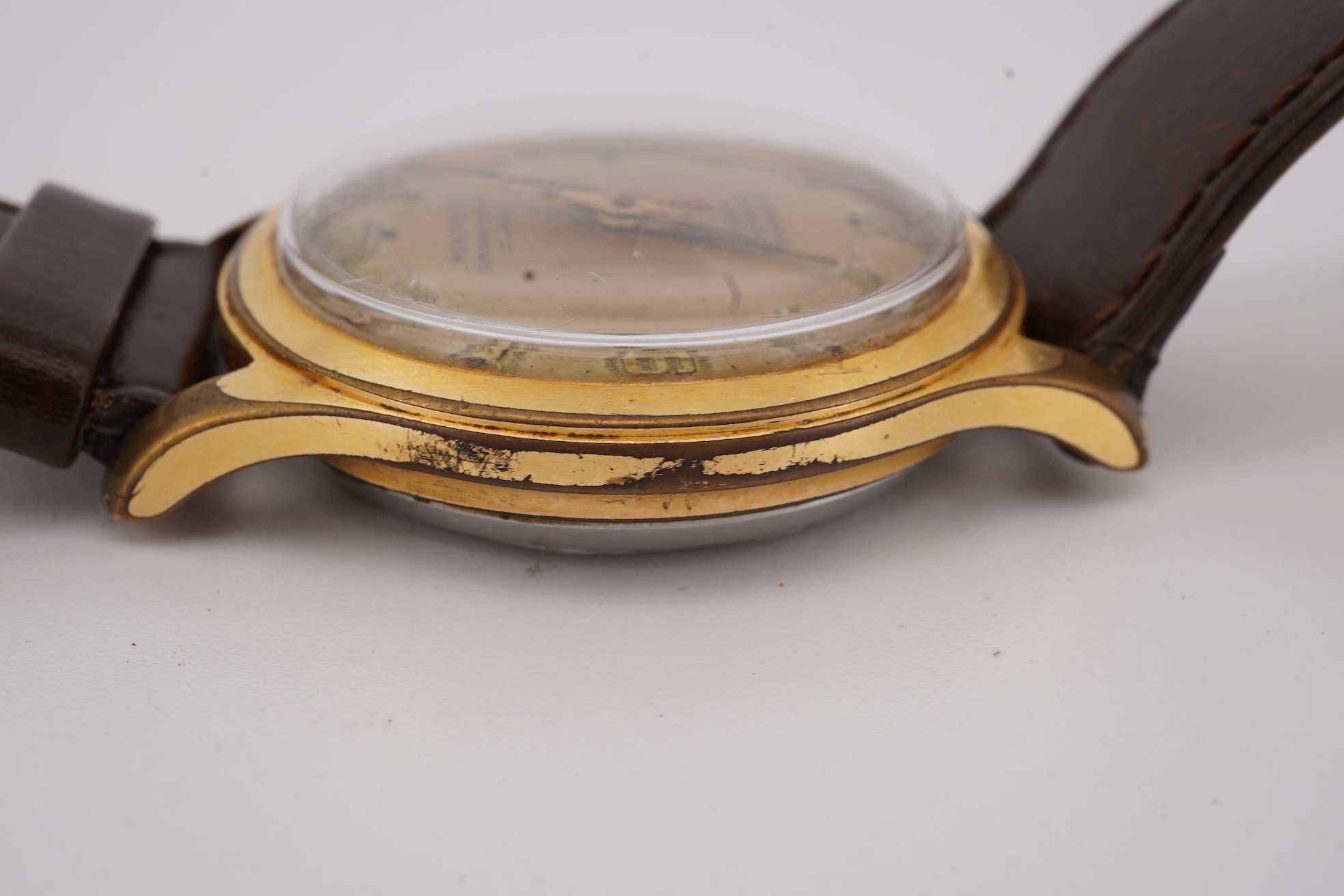 A gentleman's steel and gold plated Montfort Superautomatic wrist watch, with Roman and quarterly Arabic numerals, case diameter 34mm, on a later associated leather strap.